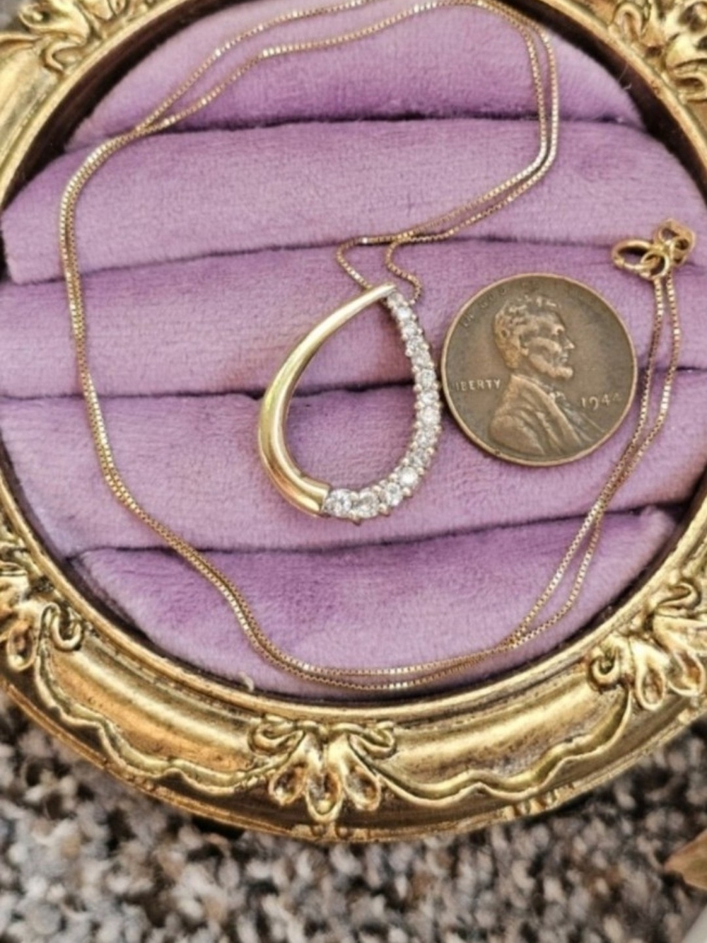14k diamond necklace! Stamped 14k on the back of the pendant and the chain clasp